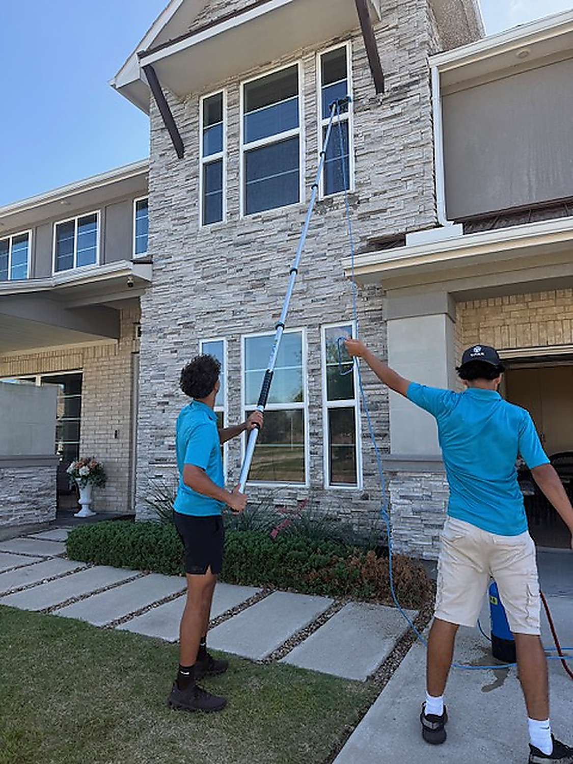 Two-story window cleaning team